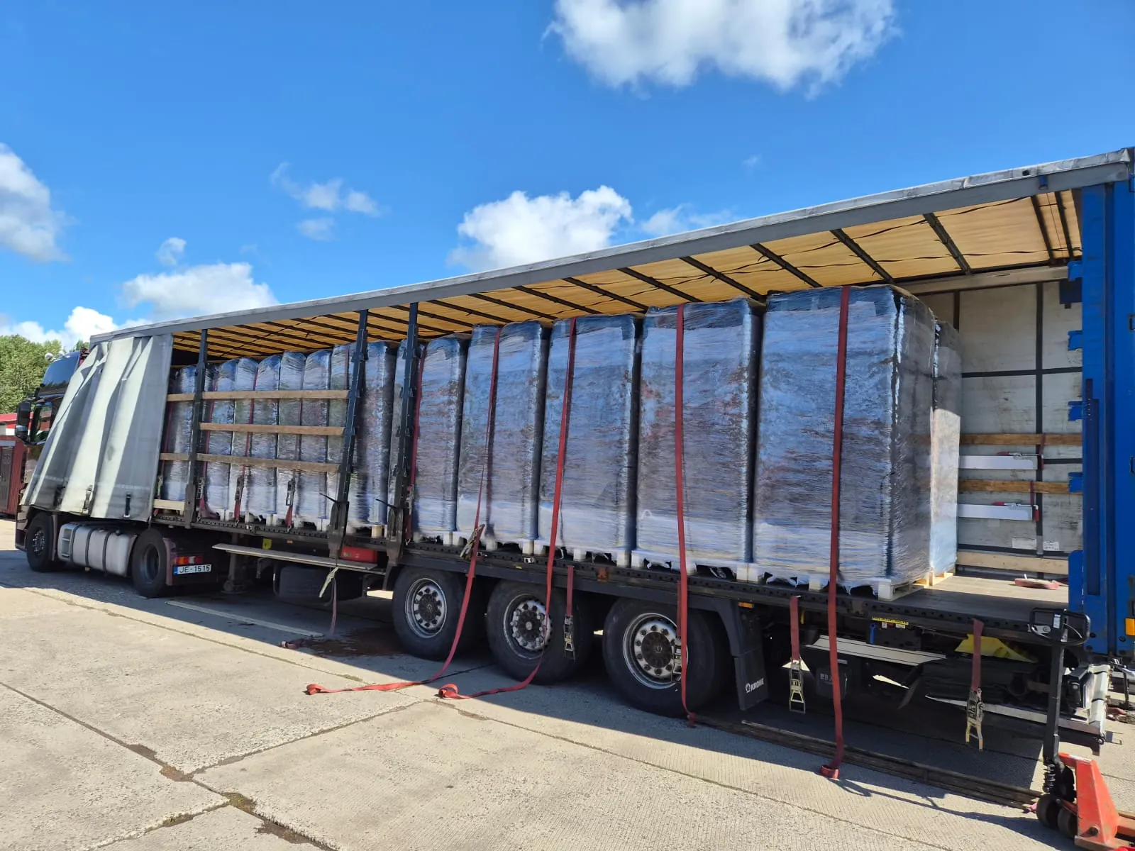 A curtain-sider truck loaded with SOLVIKA peat moss