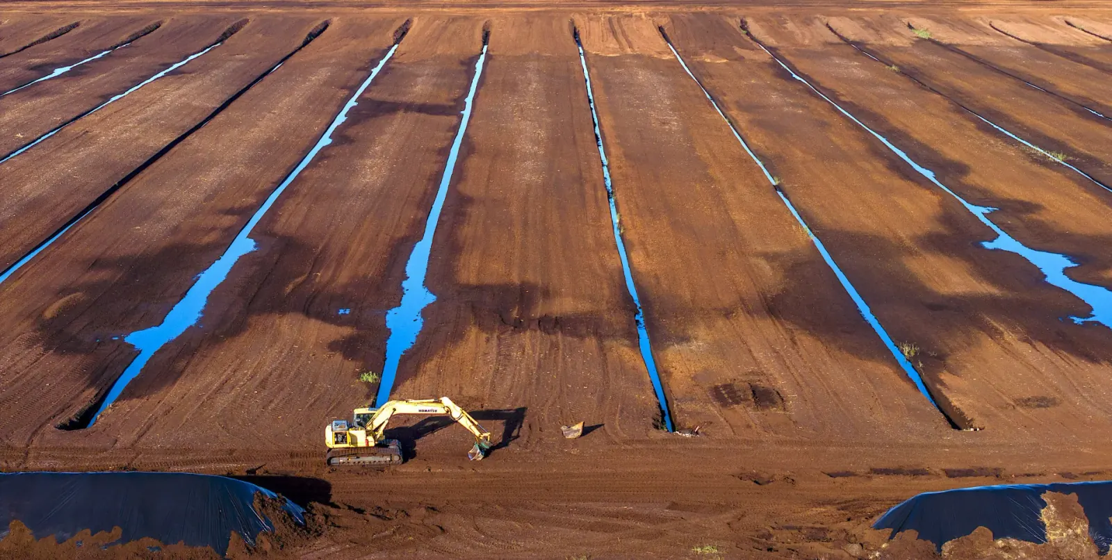 A SOLVIKA peat field in production, drainage channels cut between the fields