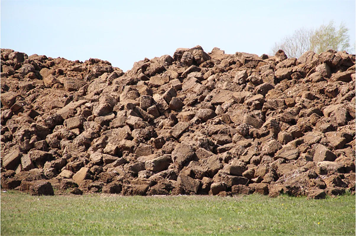 Block-cut peat sods drying in the open